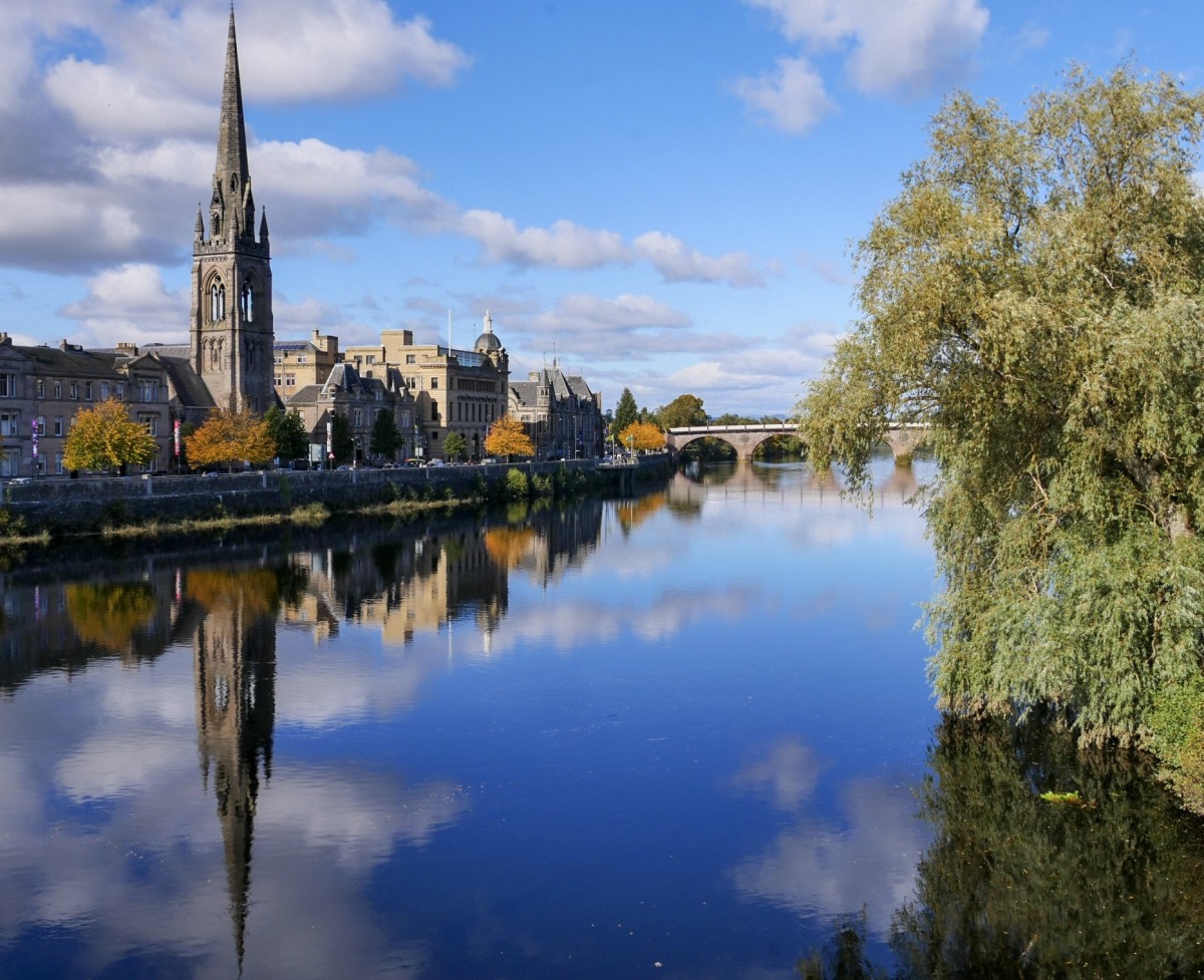 The mystical views of the reflective River Tay taken from Queens Bridge in Perth city Center looking towards Tay Street