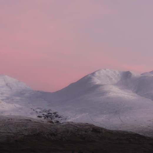 A gorgeous photograph of a red sky morning at Ben Lawers and Beinn Ghlas, Perthshire by Katherine Fotheringham