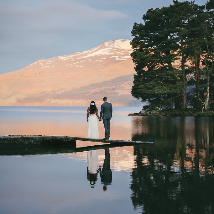 What a beautiful wedding picture by the calm water at Kenmore.