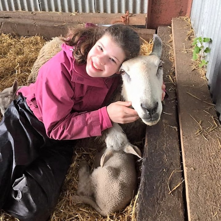 Anna sent us this picture of her cuddling Blue the sheep with her lamb. Anna stays on a farm so she has lots of 'pets!'