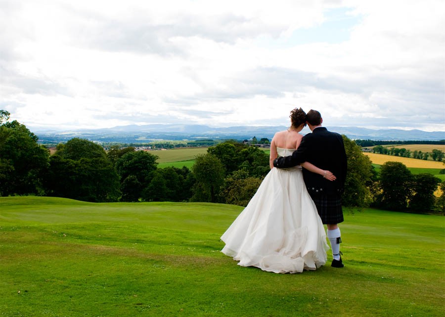 Murrayshall Weddings Bridge and groom in field