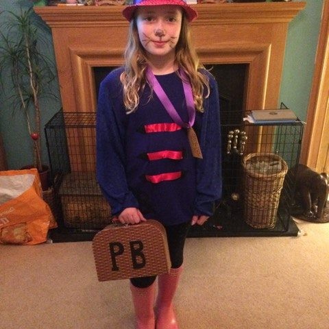 Lily looks the part as Paddington Bear-we love the little briefcase!